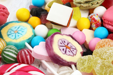 candies with jelly and sugar. colorful array of different childs sweets and treats