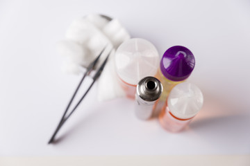 E-liquids, cotton, tweezers and electronic cigarrette for vaping