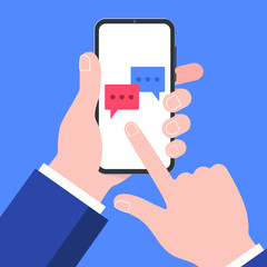 Hand holding black mobile phone isolated on blue background. Smartphone on human's hand with red and blue chat bubbles and index finger pointer touch the screen flat design vector illustration