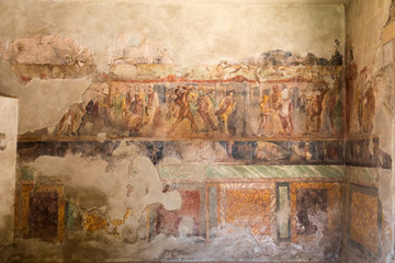 Fototapeta na wymiar Painted wall in Pompeii city destroyed in 79BC by the eruption of Mount Vesuvius