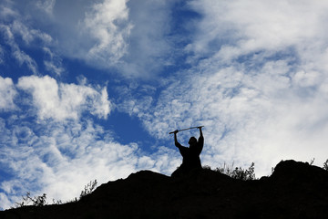 Fighter with a sword silhouette a sky ninja