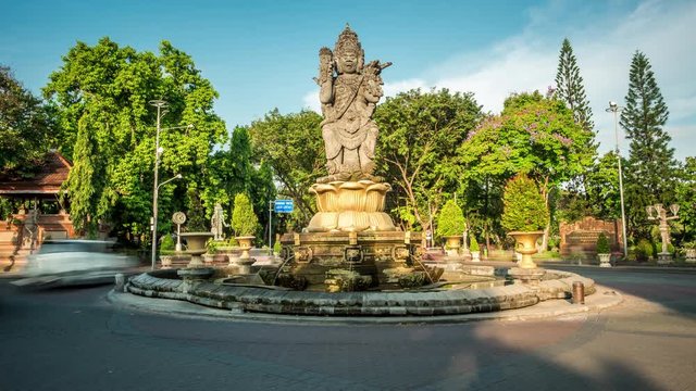 Time lapse view of traffic around the Catur Muka monument in Denpasar City, capital of Bali, Indonesia.