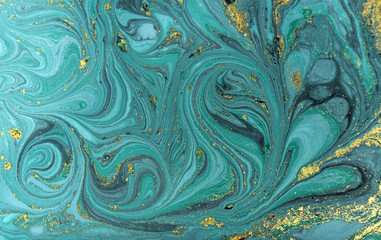 Marble abstract acrylic background. Nature blue marbling artwork texture. Golden glitter.