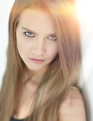 Naklejka premium closeup. face of a beautiful girl with long hair