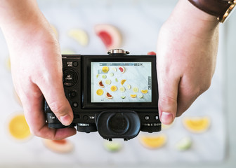 Woman photographing a food photography flatlay