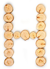 Alphabet letters made from Wood slice on white Background.H.