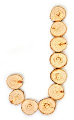 Alphabet letters made from Wood slice on white Background.J.