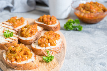 Toasted bread with vegetable caviar, made of squash, pumpkin, tomato, carrot