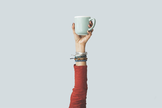 Woman Raised Arm Up Holding Coffee Cup