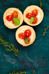 Mini tarts with cherry tomatoes