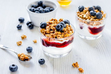 Healthy morning with granola breakfast on white kitchen table