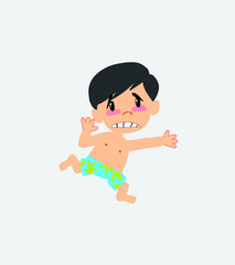 Asian boy in a swimsuit runs alarmed.