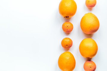 Orange fruits on white background top view mock up