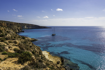 The Rabbit beach in Lampedusa, Pelagie islands is a wild beach, protected by WWF , for being home of the extinct loggerhead turtles, who lay theirs eggs in the area, 