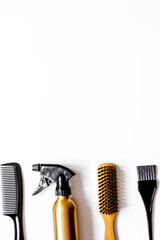 Fototapeta na wymiar combs and hairdresser tools on white background top view
