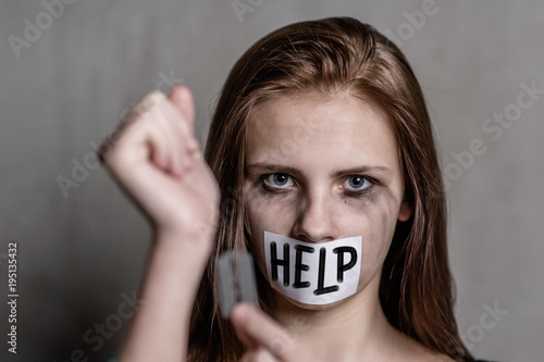Close Up Teen Girl Cuts Veins On A Hand With A Mouth Taped