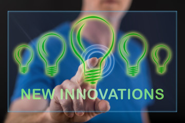 Man touching a new innovations concept on a touch screen