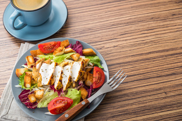 fresh chicken salad with blue coffee cup