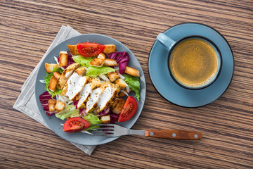 fresh chicken salad with blue coffee cup