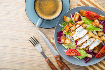 fresh chicken salad with blue coffee cup