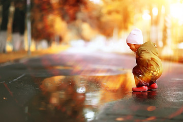 little girl on an autumn walk in the park