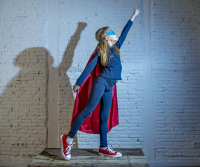 female child 7 or 8 years old young girl performing happy and excited posing wearing cap and mask...