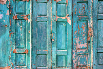 Texture of the old door. Peeling paint on wooden doors as a deta