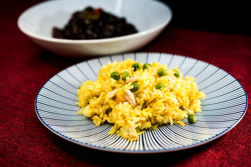 Homemade Chinese fried rice with vegetables and fried eggs