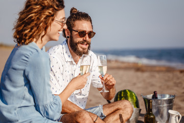 Couple Drinking Champagne on the Beach