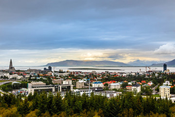 Icelandic capital panorama, streets and resedential buildings with fjord and mountains in the background, Reykjavik, Iceland