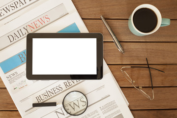 newspaper over wooden table