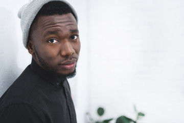 African american man in hat looking at camera