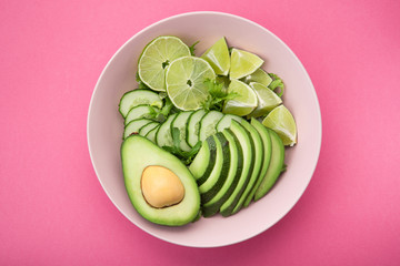 Fresh salad with avocado, green lime and cucumber