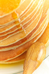 Close up of stack of pancake with honey