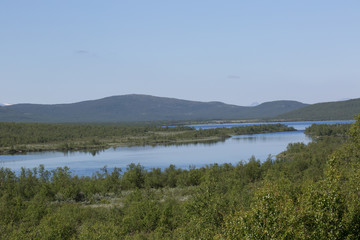 Obraz na płótnie Canvas countryside on the river könkämäeno, taiga, summer
