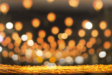 Long exposure of candle light with golden circle bokeh at night background