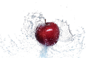 Fototapeta na wymiar Splash of water on a red apple. On white background.