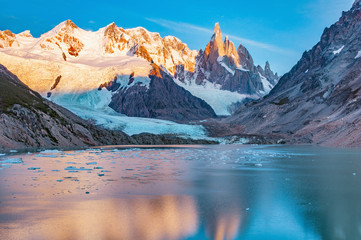 Amazing sunrise view of Cerro Torre mountain by the lake. Los Glaciares National park. Argentina. - obrazy, fototapety, plakaty