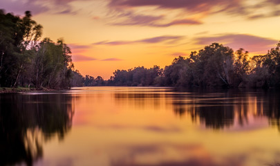 Long exposure with sunset colors on the natural border of the Guadiana river