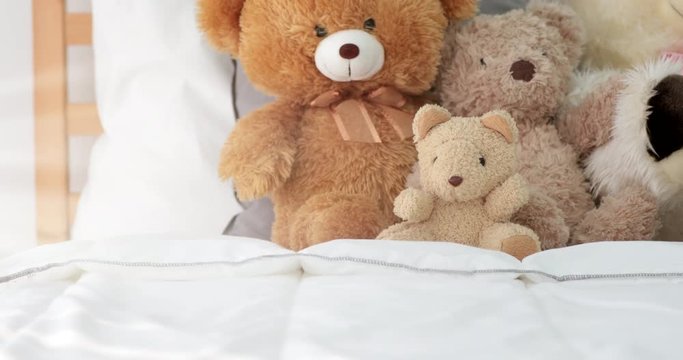 Girl room with teddy bear on bed