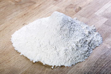 Heap of flour on table.