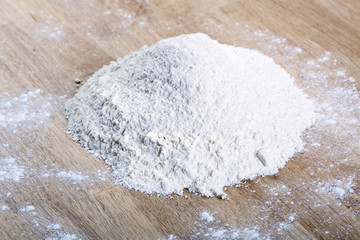 Heap of flour on table.