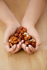 Nuts Heart. Hands Holding Different Nuts