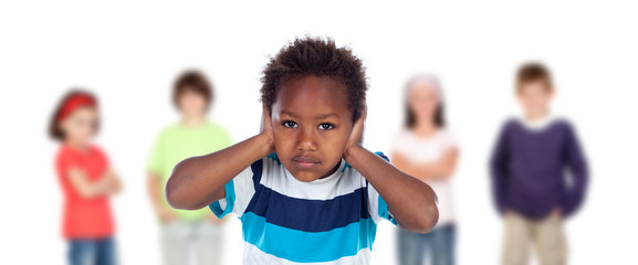 Sad child covering his ears isolated on a white background