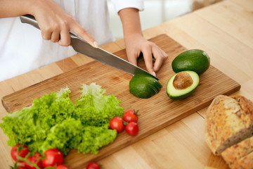 Nutrition And Diet. Close Up Of Woman Hands Cutting Products. 