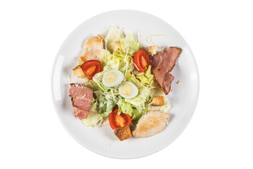 Salad in taller isolated on white background. Top view.