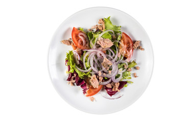 Salad in taller isolated on white background. Top view.