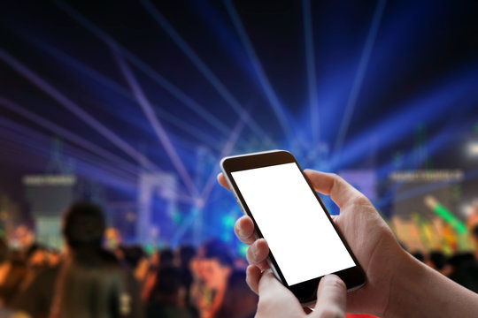 Smart Phone Showing Blank Screen In Man Hand At Night Festival Blur Background