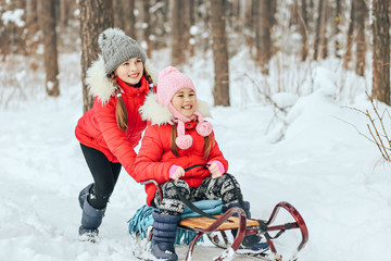 little children play and frolic in the winter