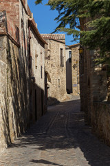 Fototapeta premium Beautiful old stone houses in Spanish ancient village, Pals, in Costa Brava